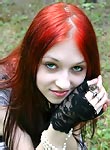 Goth redhead teen in ripped stockings funs in park