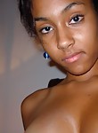 Hot ebony teen shows off her titties for the camera