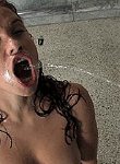 Hotny dark haired beauty gets pissed on from several different guys and sucks cock