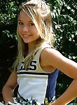 Pretty teen cheerleader working her pussy well on cam