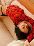 Teen in black panties plays in couch