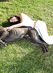 Sexy brunette teen plays with her cane corso